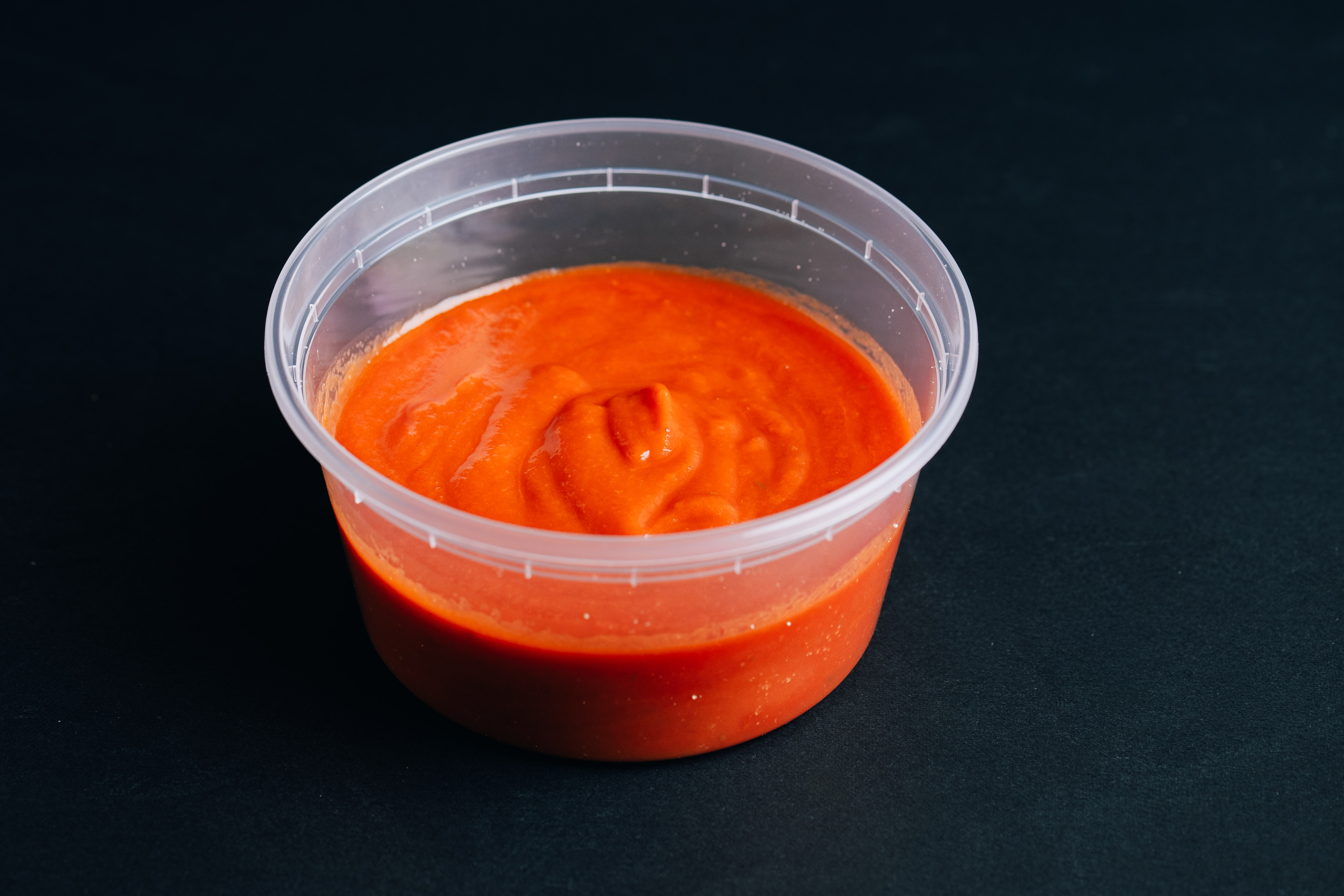 Small-batch house sauce in a 12 oz container from da Cecot, Edmonton